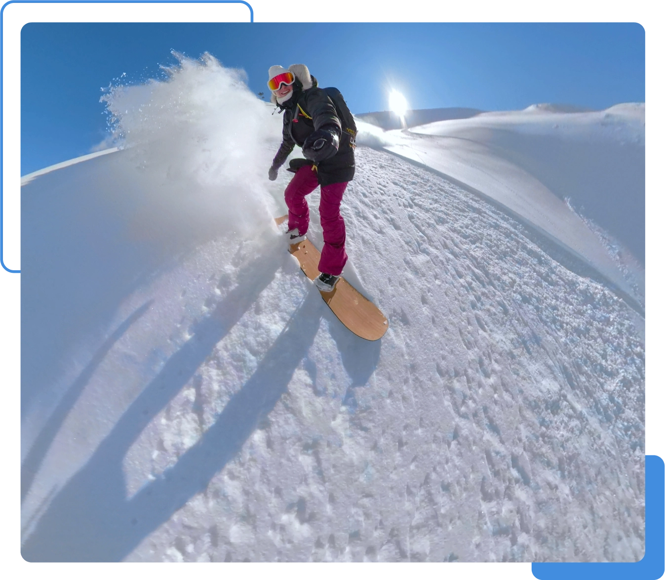 Snowboarder carving down a snowy slope.