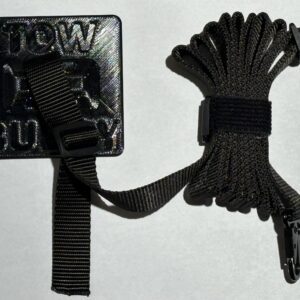 A coiled black paracord with a buckle and patch.